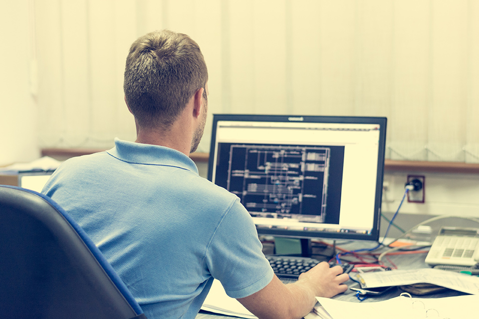 Engineering working on computer.